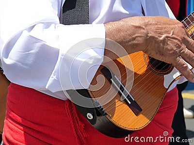 Canary Islander playing traditional 5-stringed folk instrument called a â€œtimpleâ€ Stock Photo